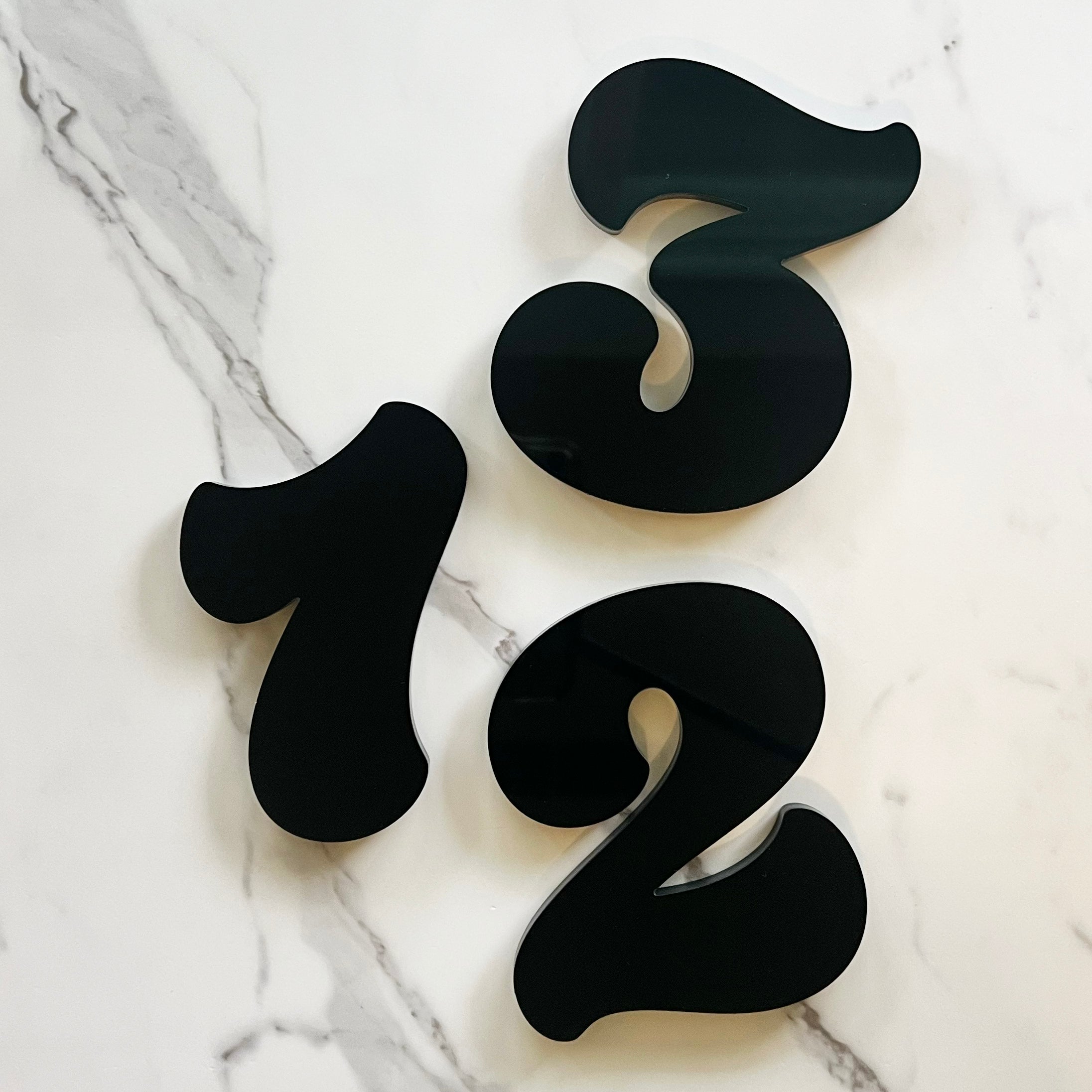 1970's style house numbers in a thick black style