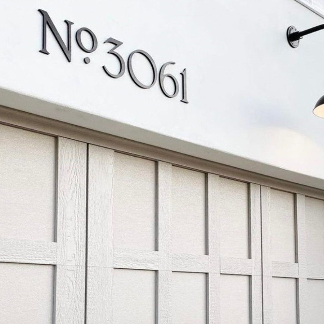 Decorative address numbers in black acrylic with 'No 3061' text on a white background