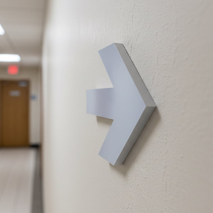 Modern wall-mounted light fixture on a neutral-colored wall