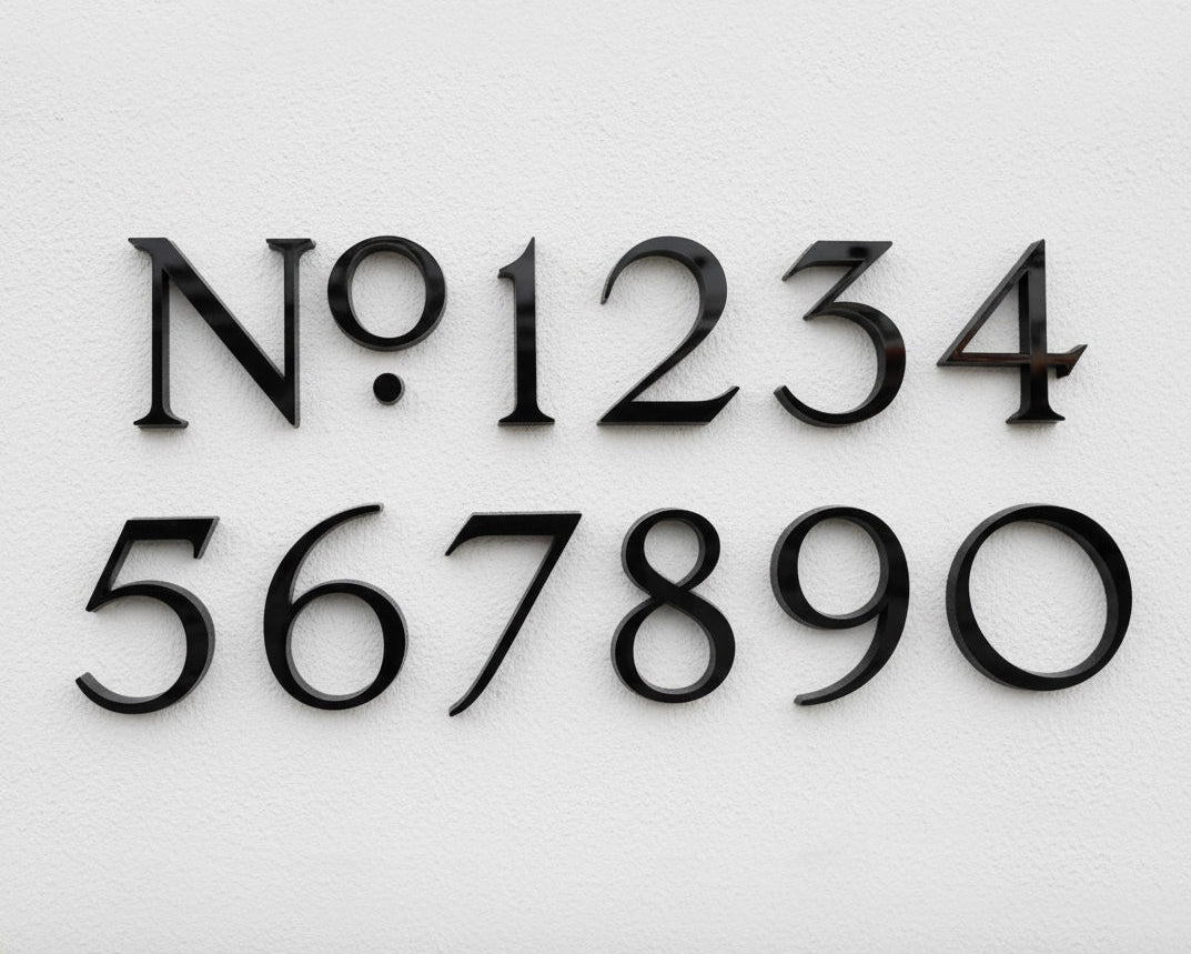 Black acrylic house numbers on a white background