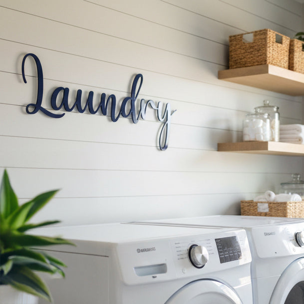 Laundry room with a 'Laundry' sign on the wall above a washer and dryer.