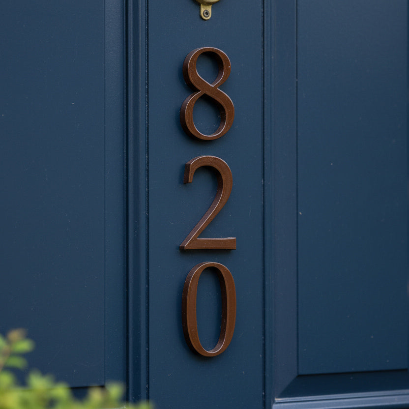 House numbers '820' on a blue door