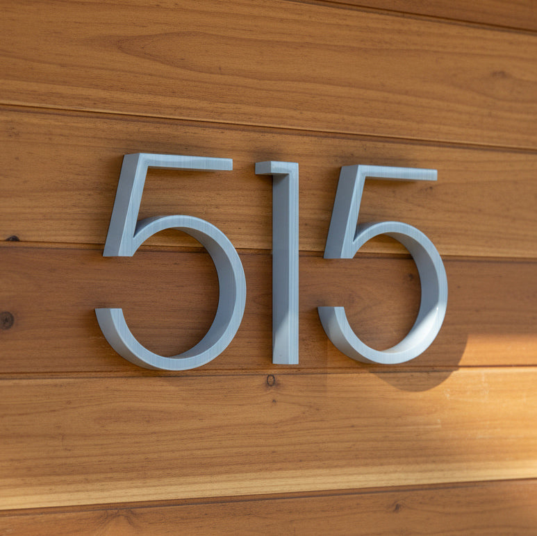 light blue House numbers '515' on a wooden background