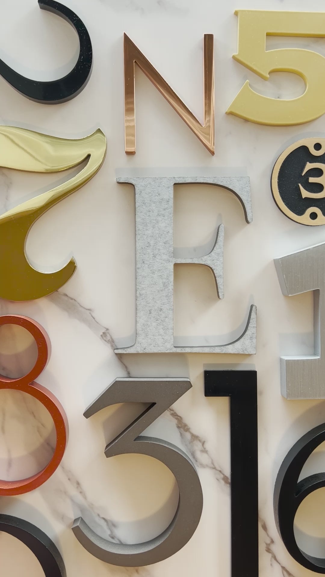 A Video of All the materials Dropcap Studio sell on their site including acrylic, solid brass, solid copper, Aluminum and plaques