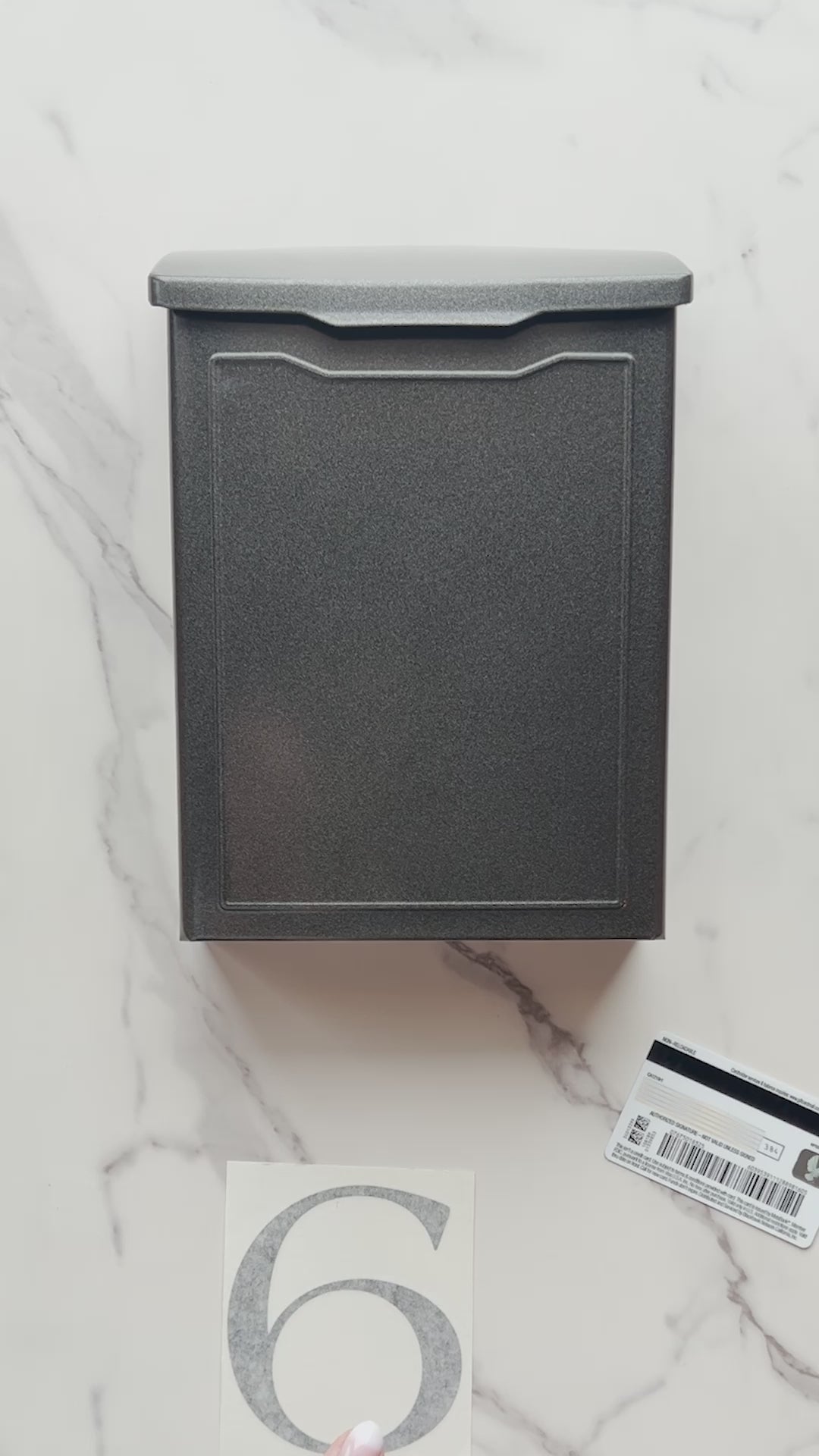 Installing easy mailbox stickers on a brown mailbox