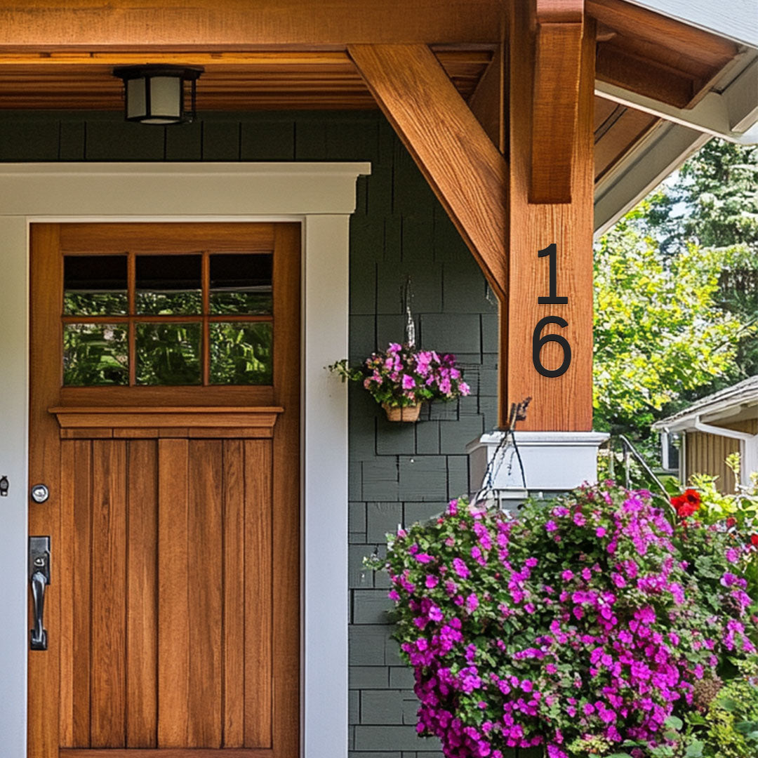 Craftsman house style with wood beams and black 6 inch house numbers