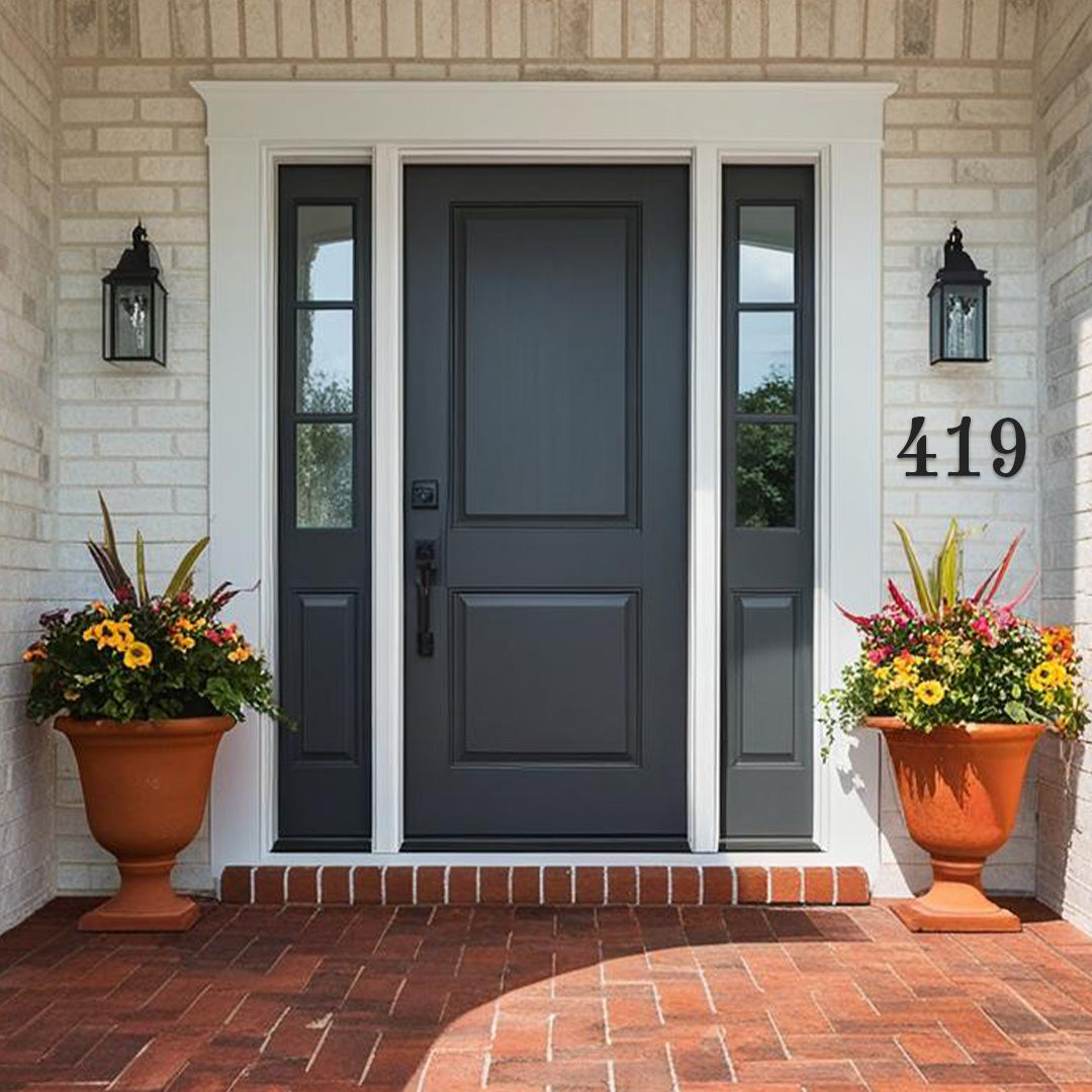 Traditional 4 inch house numbers in black on a white brick house with red brick porch