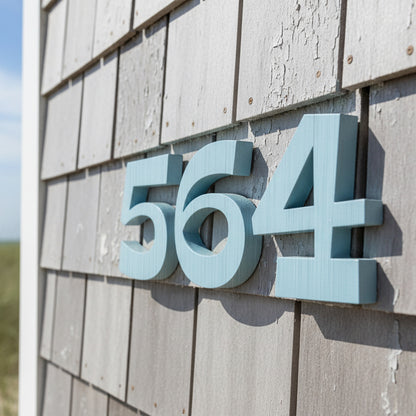 House numbers '564' on a wooden wall