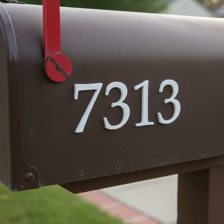 Mailbox with the number 7313 on a blurred background