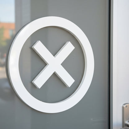 White 'X' symbol on a gray door