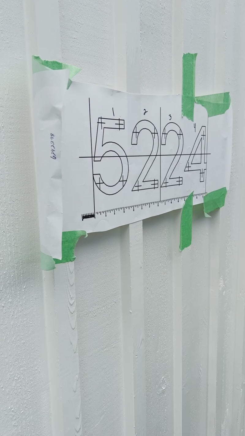 House number install of black metal house numbers from dropcap studio