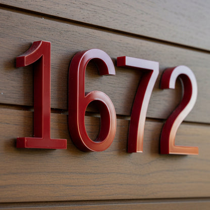Red house numbers '1672' on a wooden background