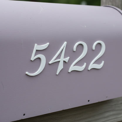 Purple mailbox with white house numbers '5422'