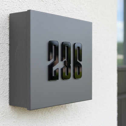 Modern house number '238' on a gray box mounted on a textured wall.