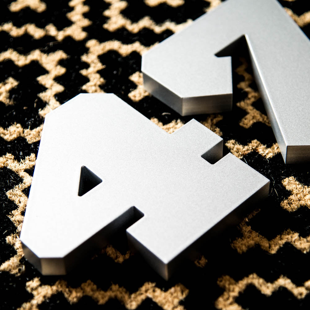 Silver modern house numbers in a thick style
