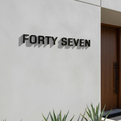 Modern building facade with 'FORTY SEVEN' branding on a white wall.