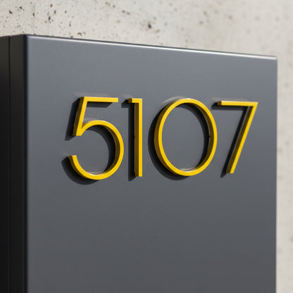 Yellow Modern house number '5107' on a gray mailbox